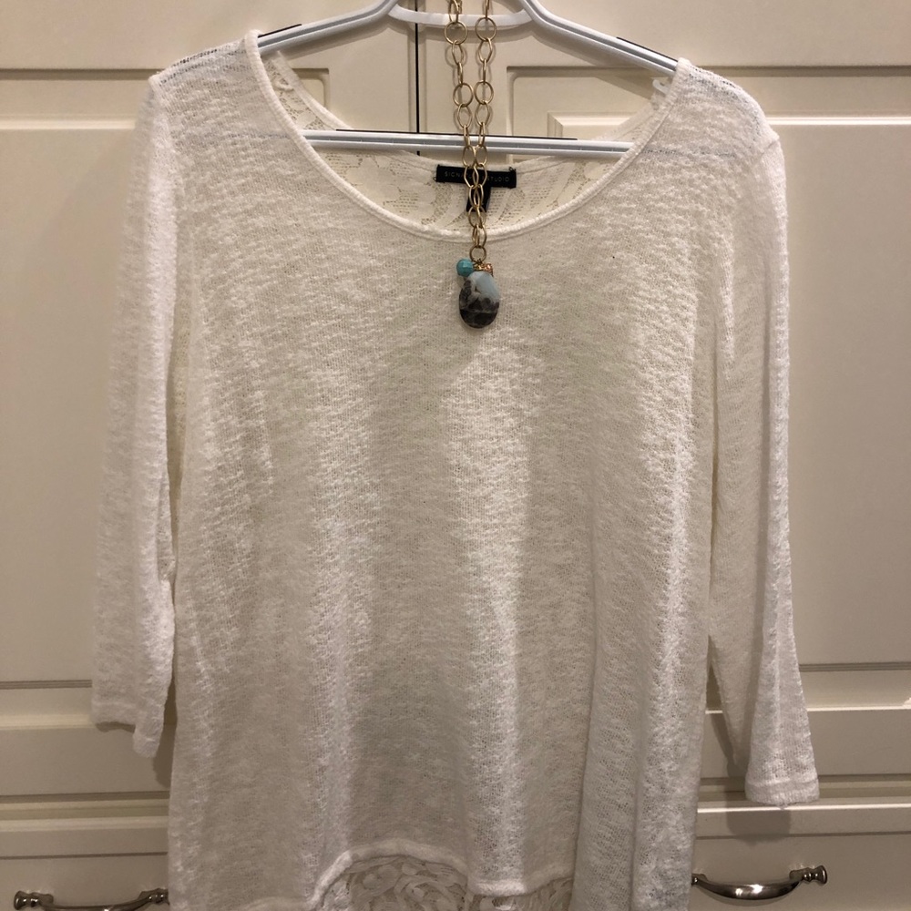 White top with lace accent and zipper in the back